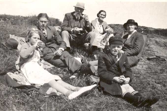 Stuart and family at the harvest, 1940